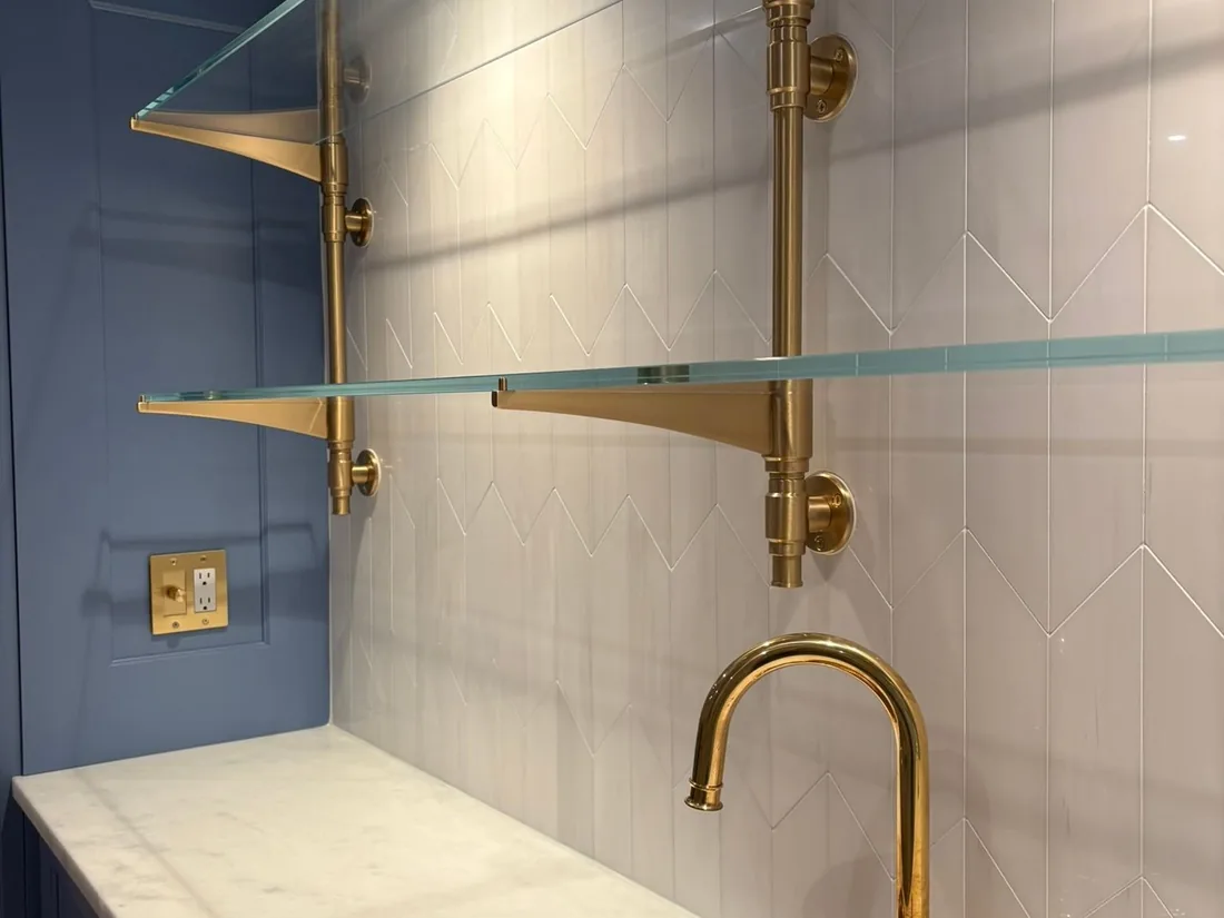 Finished basement bathroom with shower and tile