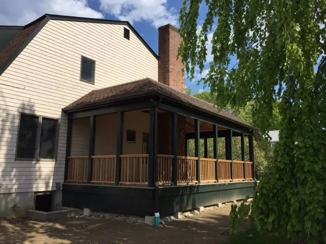 Newport screened porch with architectural shingle roof, brick chimney and integrated gutters