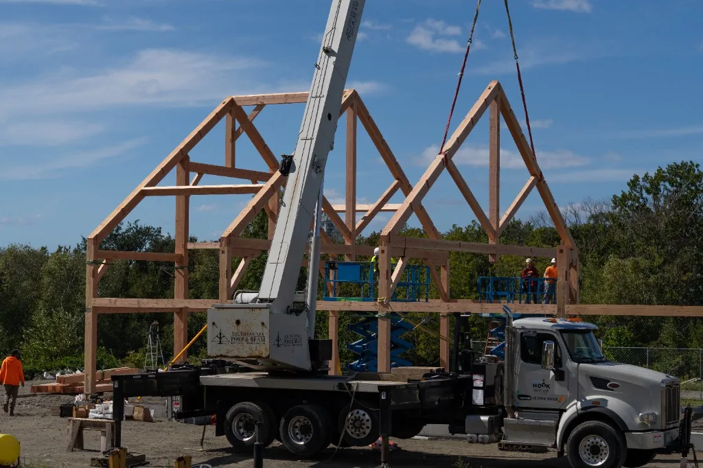 Wide view of the post-and-beam frame under construction at Ragged Island Brewing